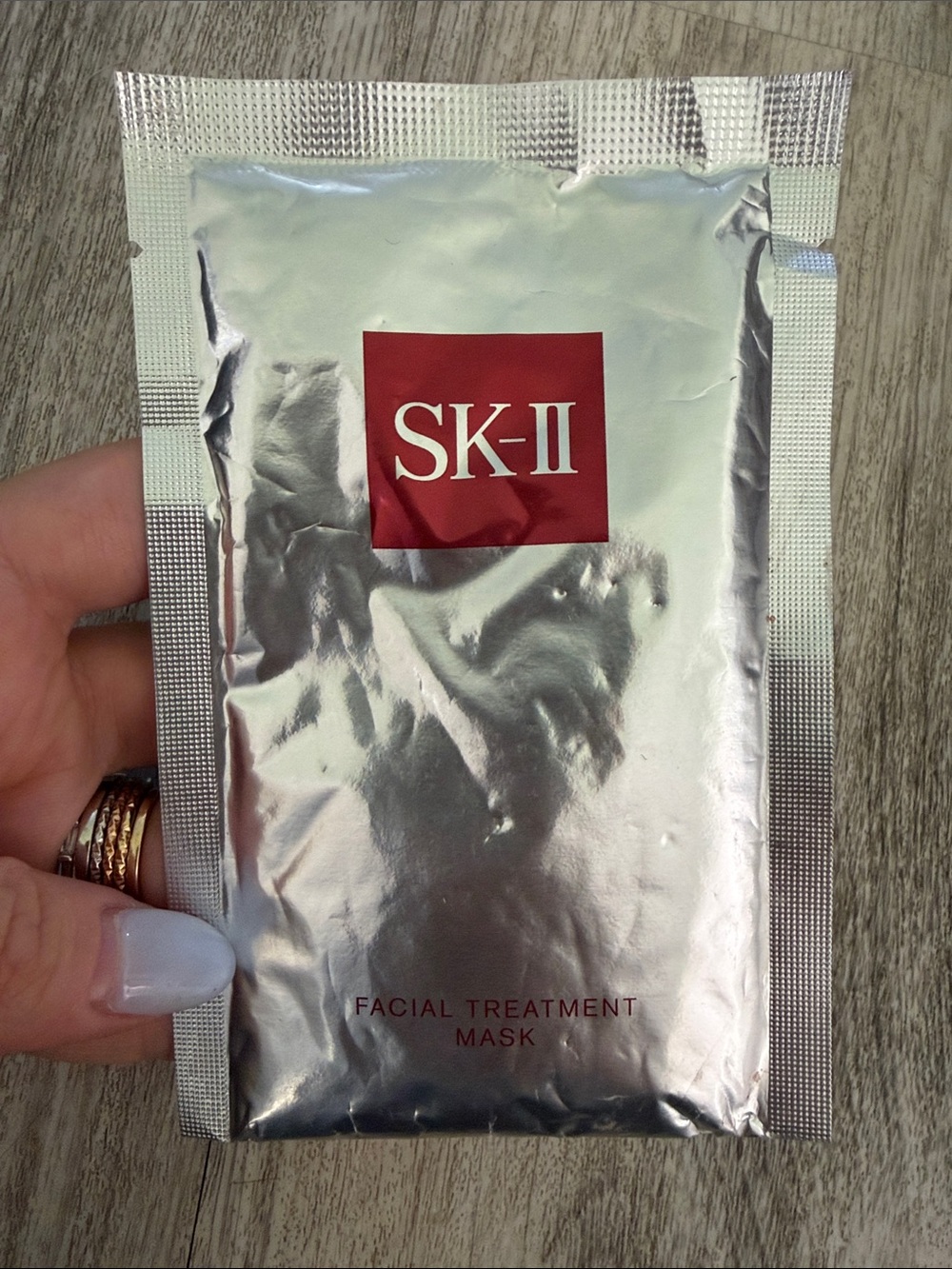 SK-II Facial Treatment Mask in Silver with Red Logo